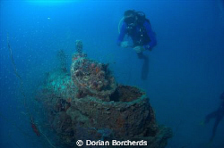 Diver next to a Japanese 2 Man Mini Sub conning tower.Use... by Dorian Borcherds 